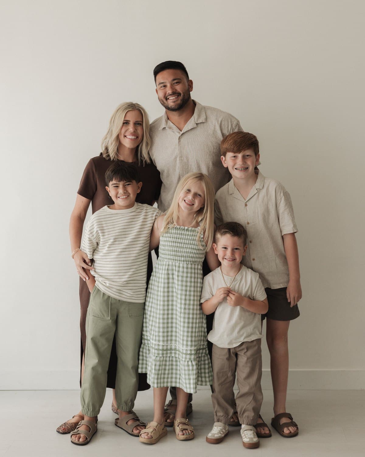 Jimmy and Brianna Schwager with their four children — a family portrait